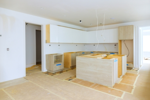 Installing new custom kitchen cabinets and countertops.