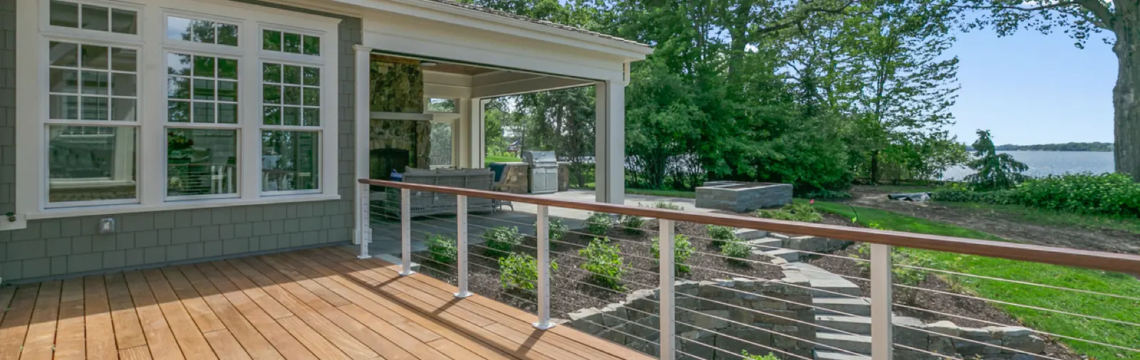 Person building a wooden deck with power tools