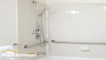 Bathroom shower with securely installed stainless steel grab bars and handheld shower mounted by Mr. Handyman of Bethlehem.