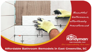 Handyman installing bathroom tile.