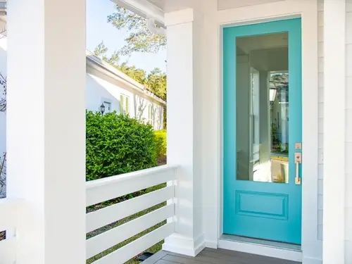 Statement front door entrance with glass paneling and color boosting curb appeal.