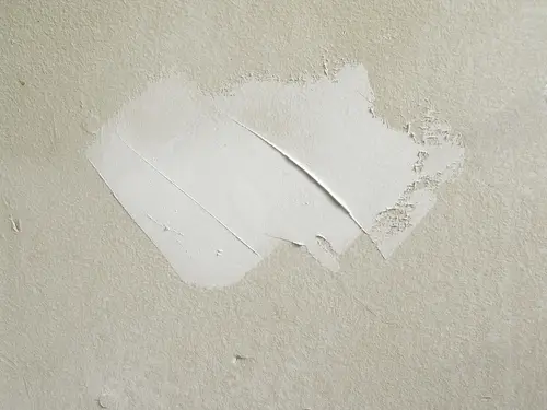 Close up of drywall mud patch.