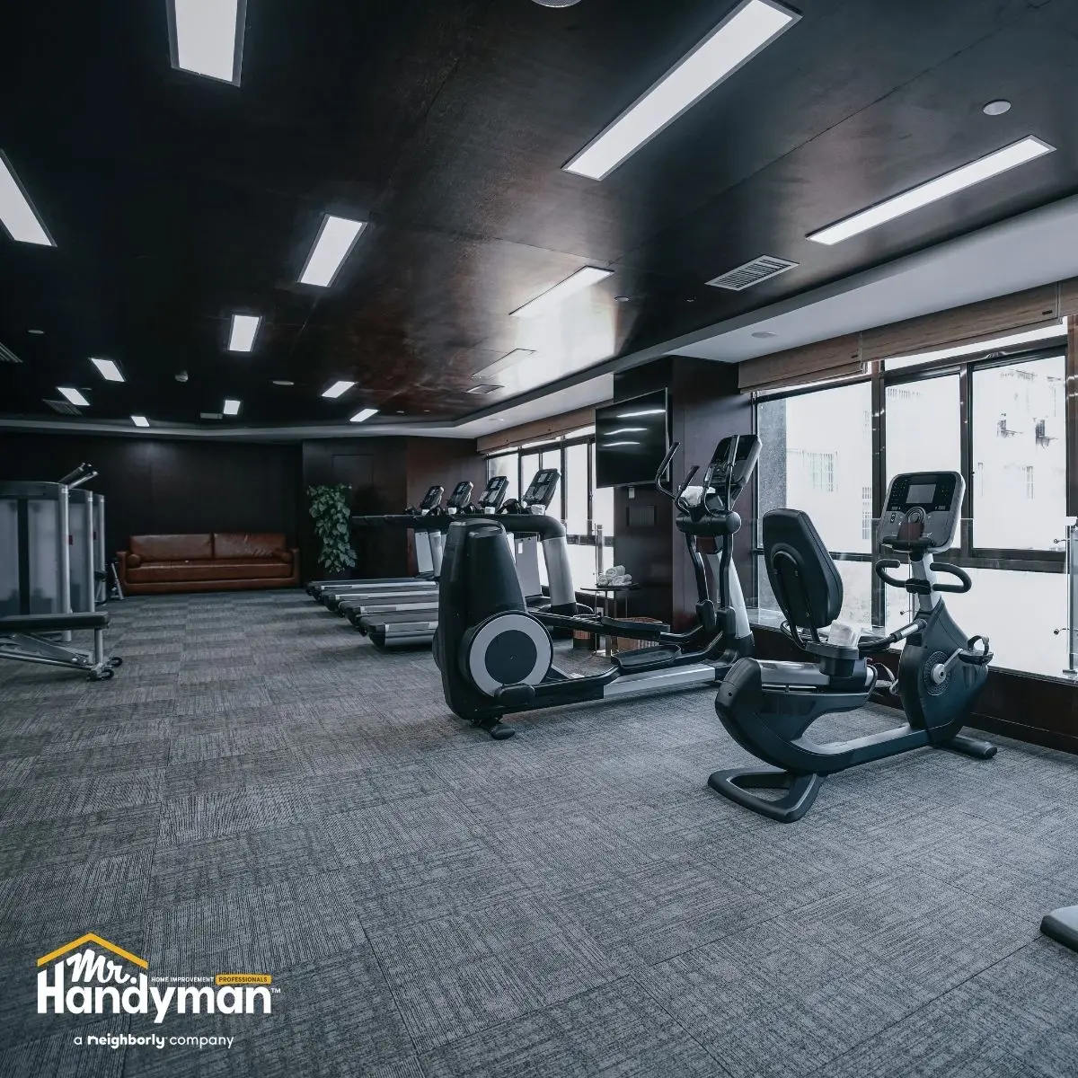 handyman assembling commercial gym equipment in Oklahoma City fitness facility.