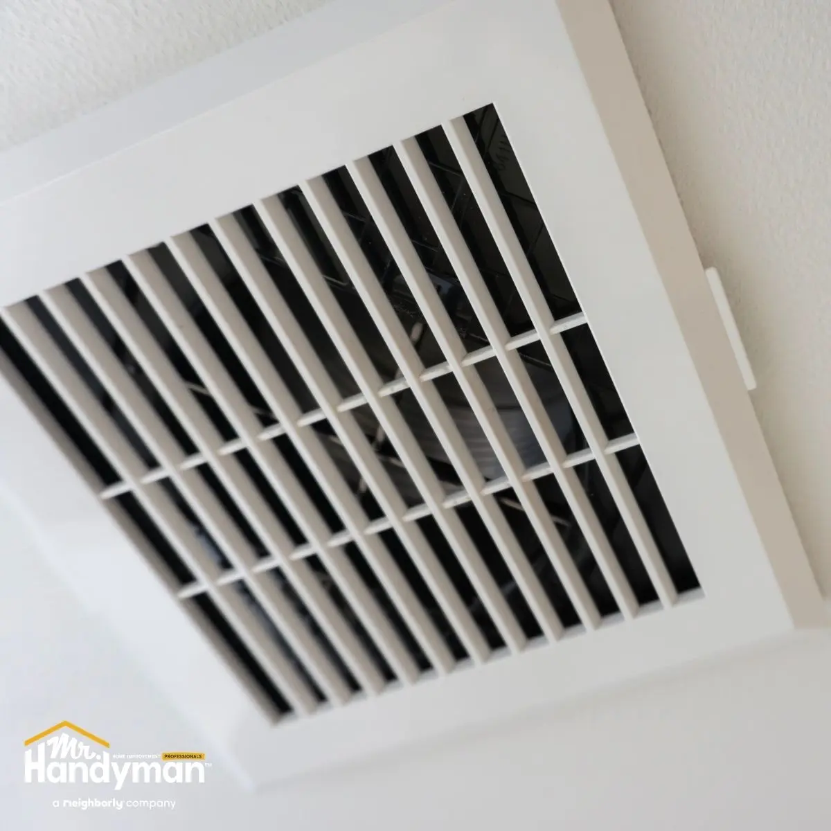 Mr. Handyman technician performing HVAC maintenance to improve air quality at a Nashville fitness facility