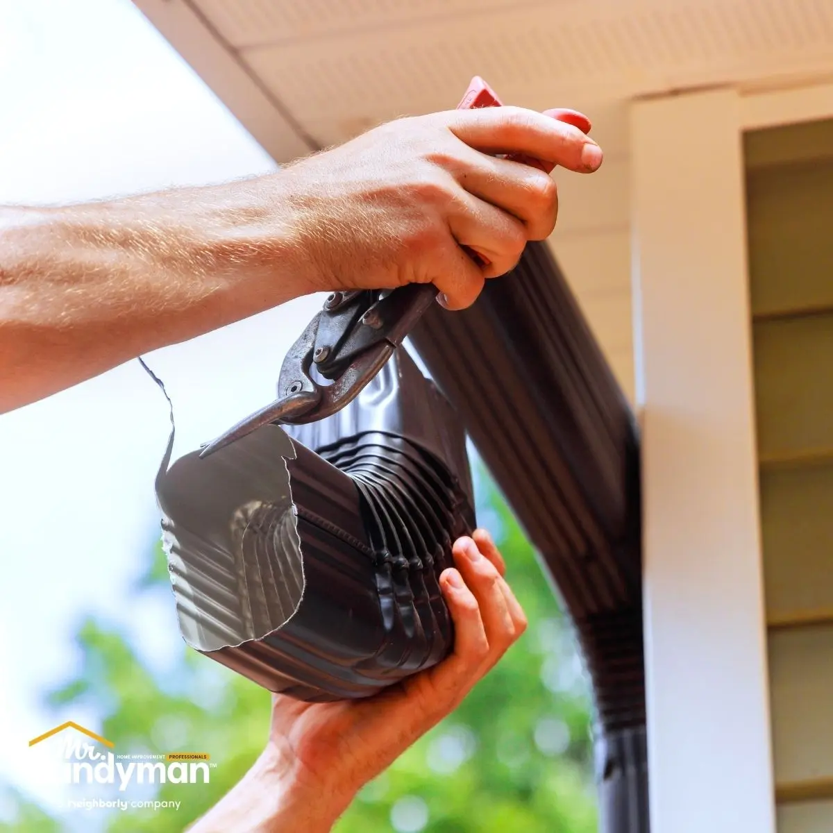 Mr. Handyman technician inspecting and preparing a South Bend Northern Indiana home exterior for spring and warmer weather ahead.