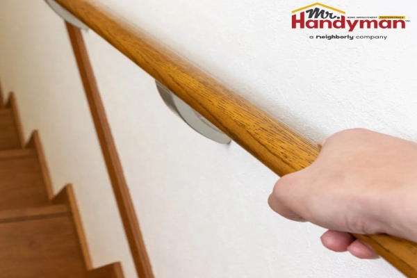 Mr. Handyman technician installing grab bars and accessibility hardware in a bathroom for aging-in-place safety in a Mishawaka, Indiana home.