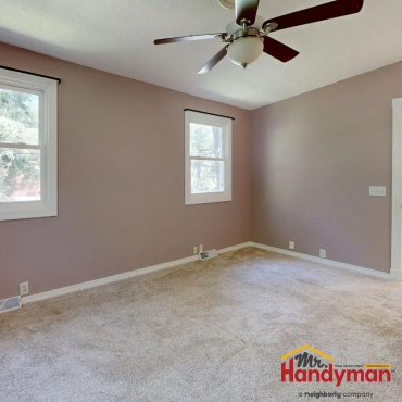 carpenter installing crown molding.