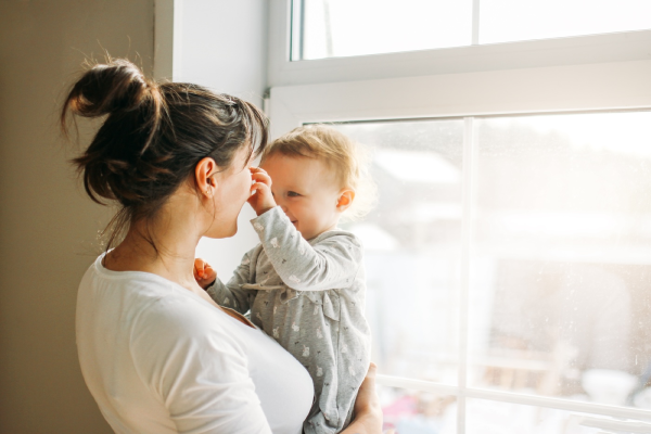 Family in front of single hung window.