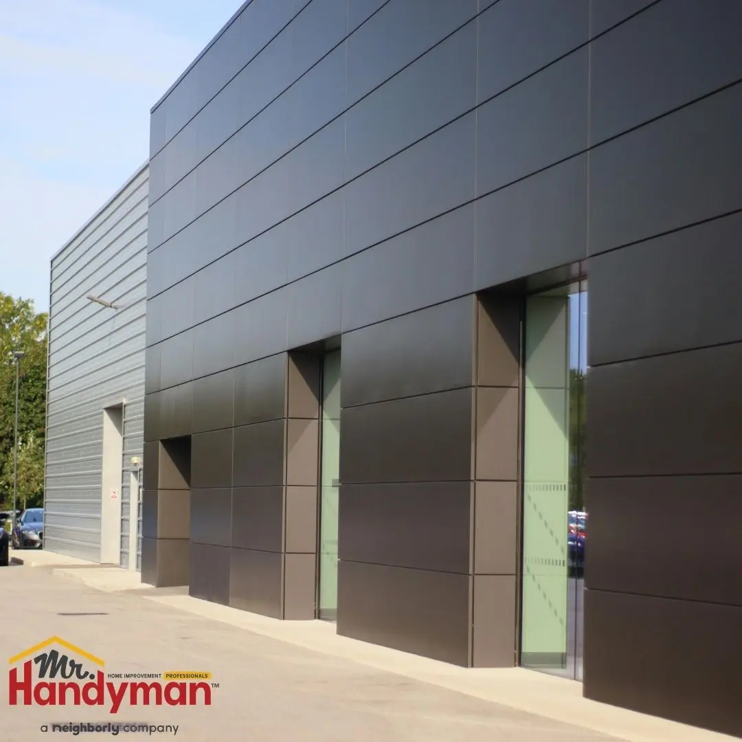 handyman performing commercial building maintenance before summer