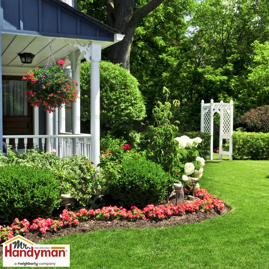 A charming garden scene with a white porch.