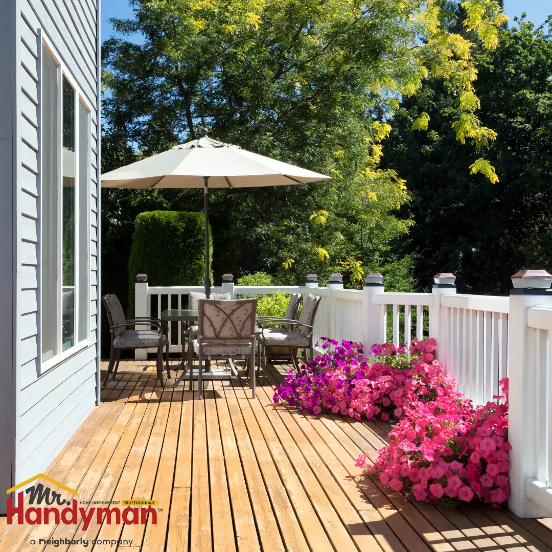Handyman installing string lighting over a patio at a Murfreesboro, TN home