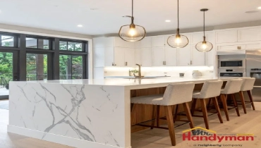 Mr. Handyman technician installing kitchen island cabinetry in a Charleston, South Carolina home ahead of summer entertaining season