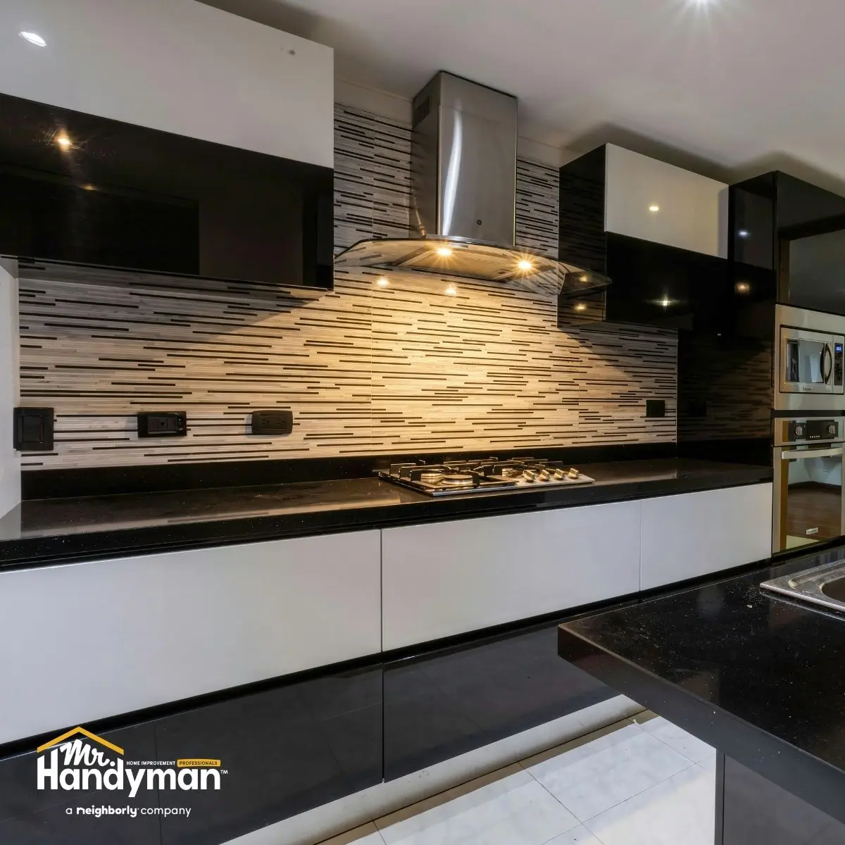 modern kitchen with stainless steel appliances and a tile backsplash