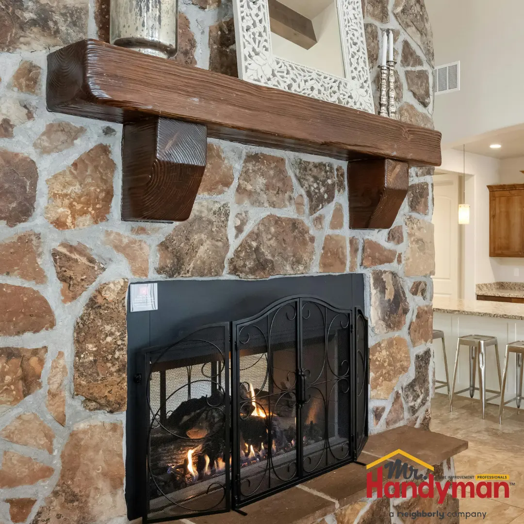 A cozy living room with a fireplace as the focal point.