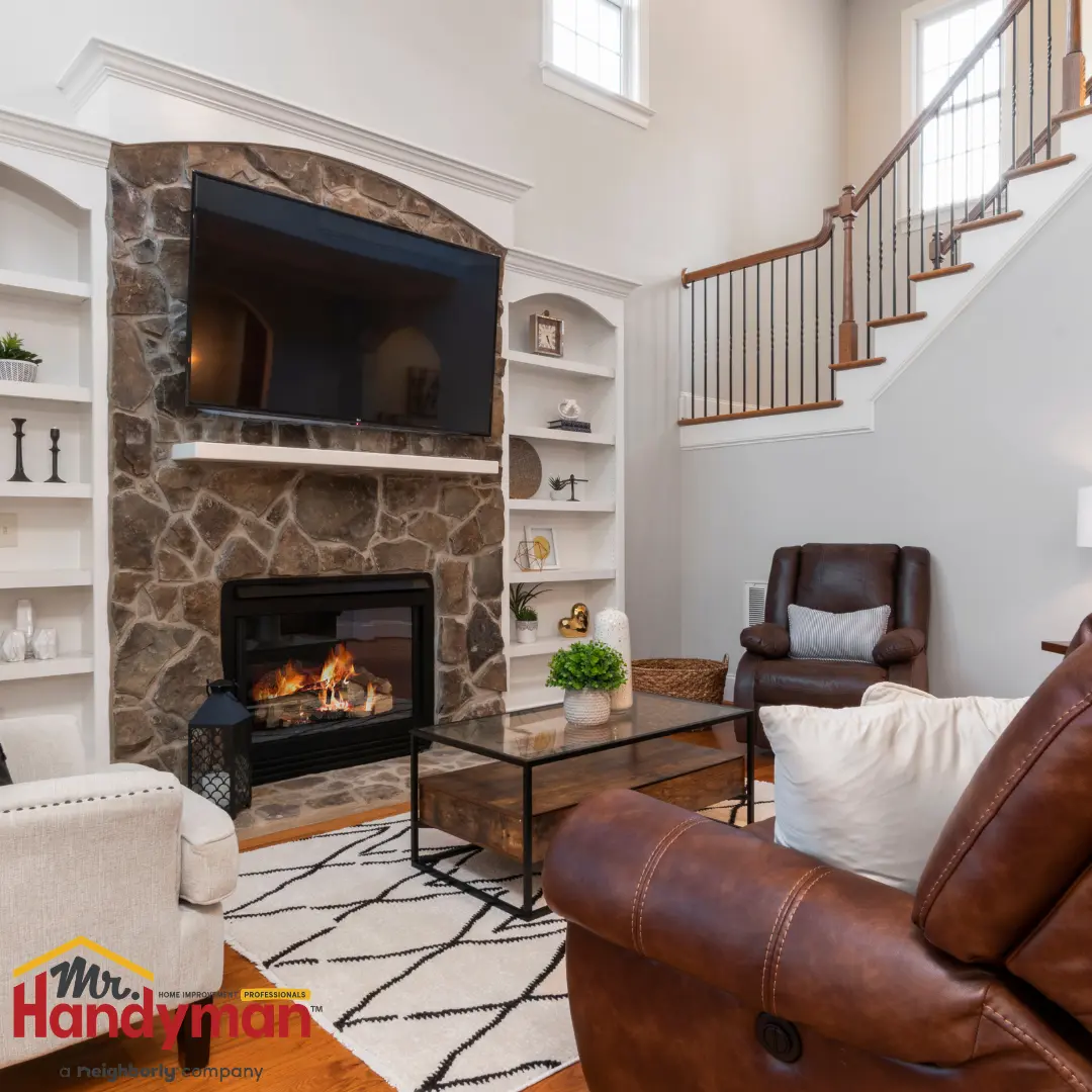A cozy living room with a fireplace as the central feature.