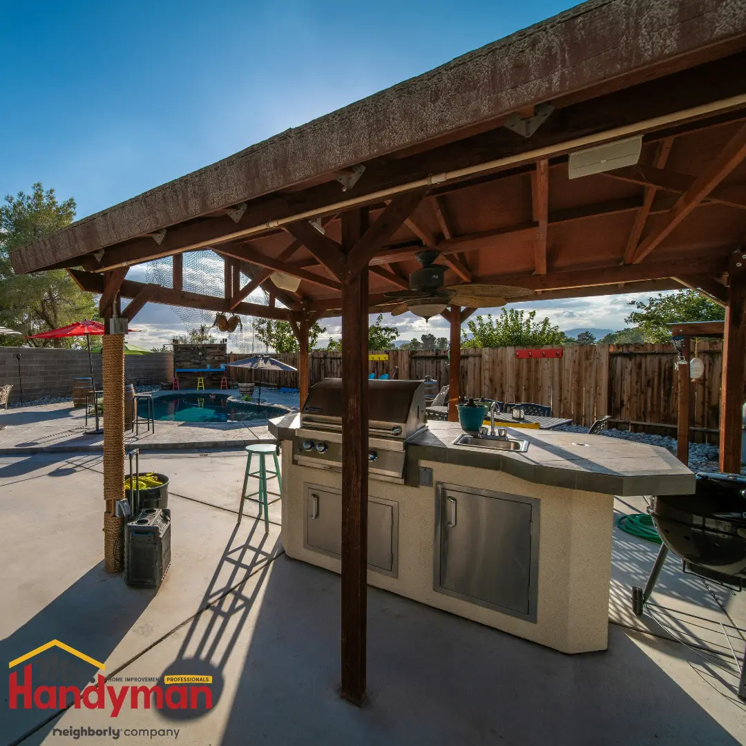 Handyman building an outdoor kitchen counter at a West Nashville, TN home.