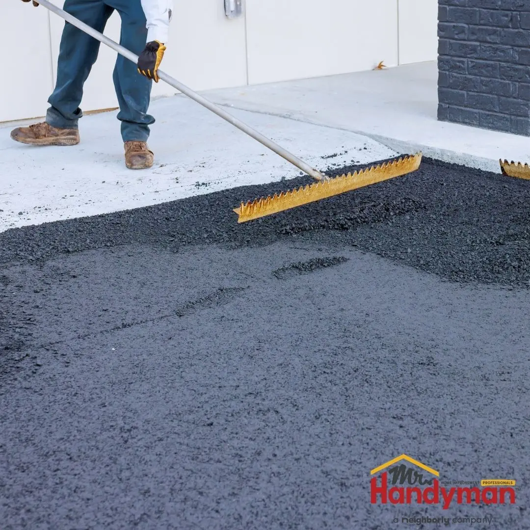 Handyman inspecting a commercial parking lot for safety hazards in Martinsburg West Virginia.