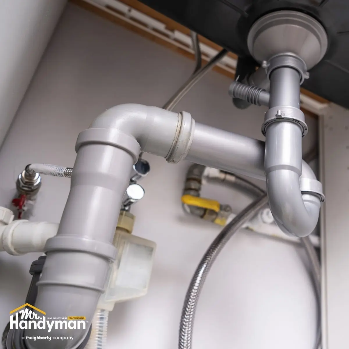 technician completing a spring plumbing inspection at a Charleston South Carolina home before Low Country