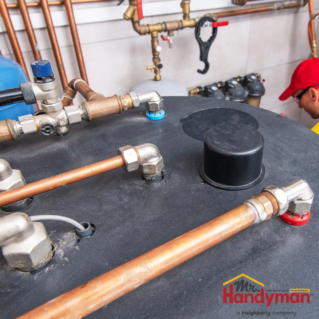 Pipes and valves connected to a water heater.