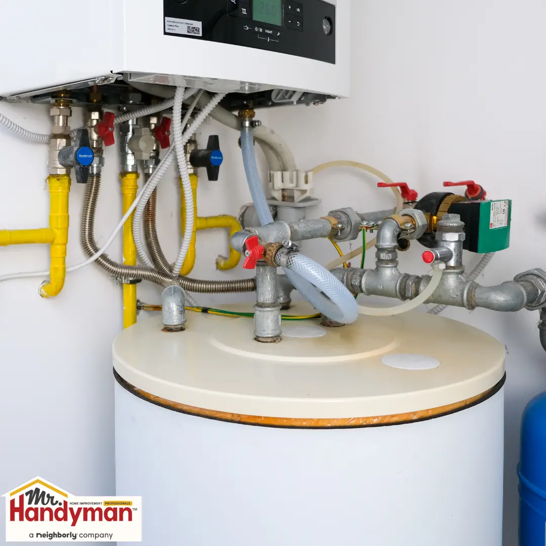 Hot water heater system with connected pipes, valves, and control unit.