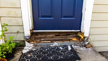 Repairing wood rot on door.