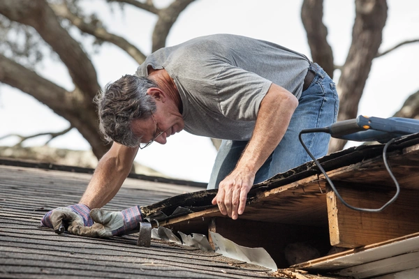Removing rotten deck.