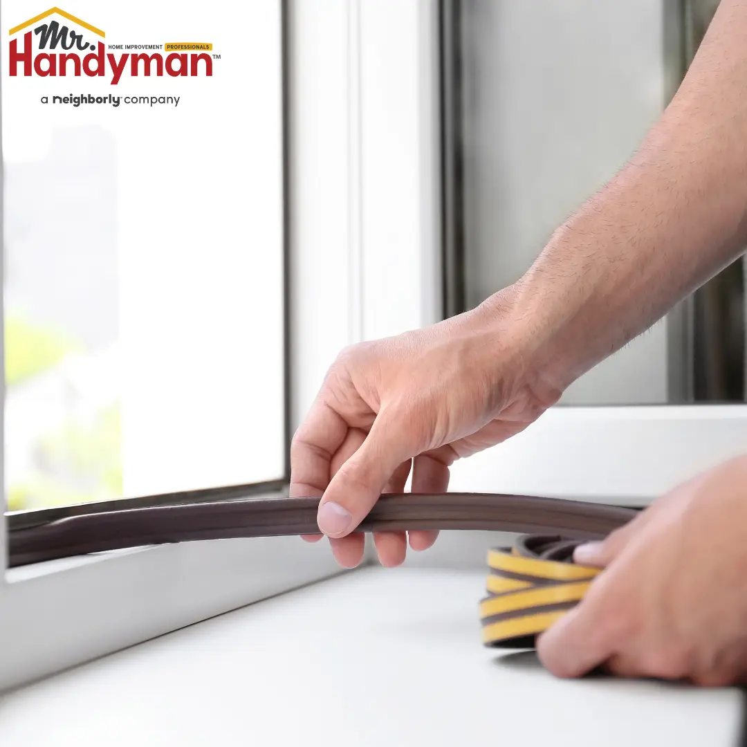 Mr. Handyman technician repairing a dripping faucet and exterior caulking on a South Bend, Indiana home to prevent larger damage