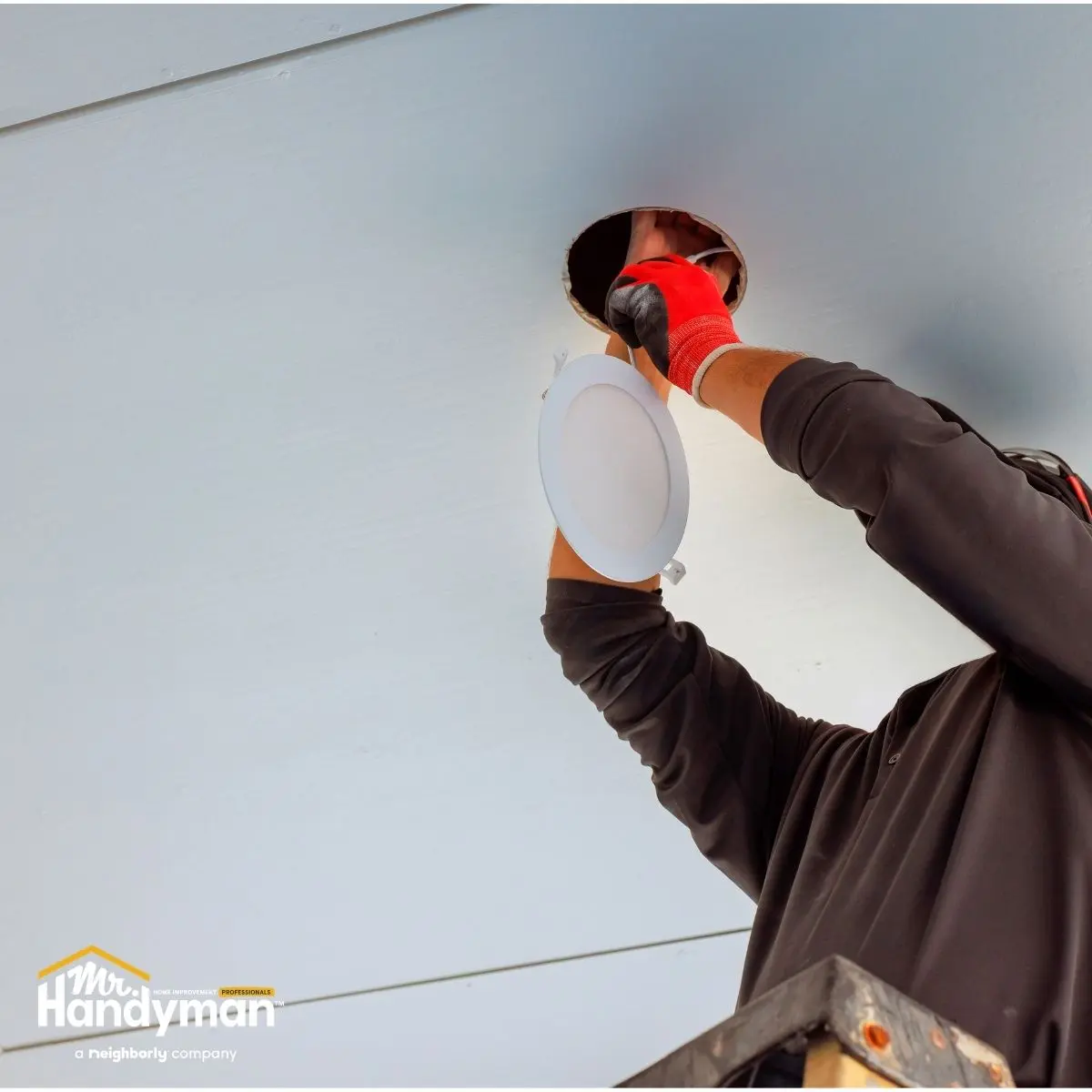 Mr. Handyman technician conducting spring property inspection at Wichita rental property