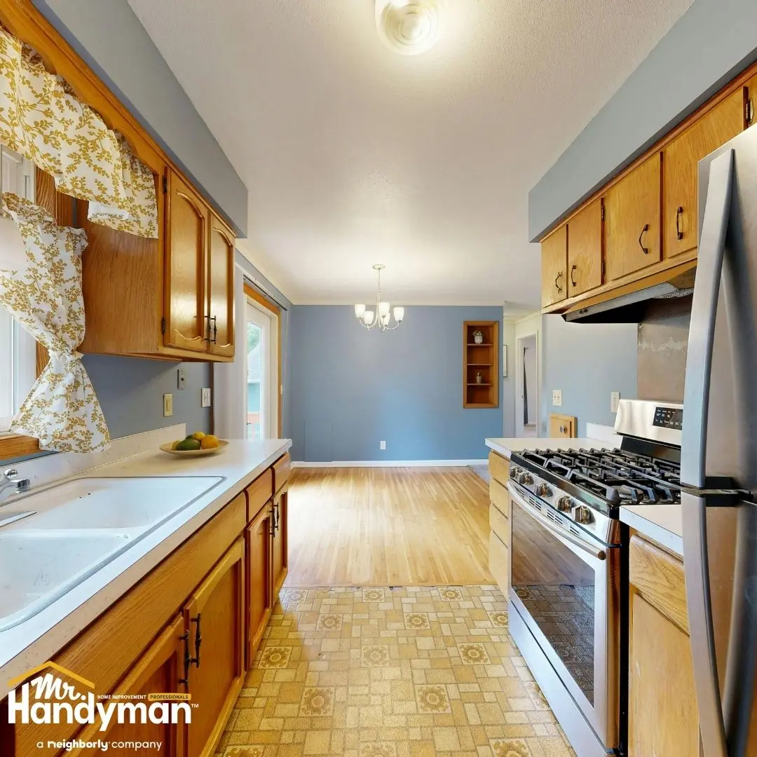 Bright kitchen with wooden cabinetry, modern appliances, and a cozy dining area.