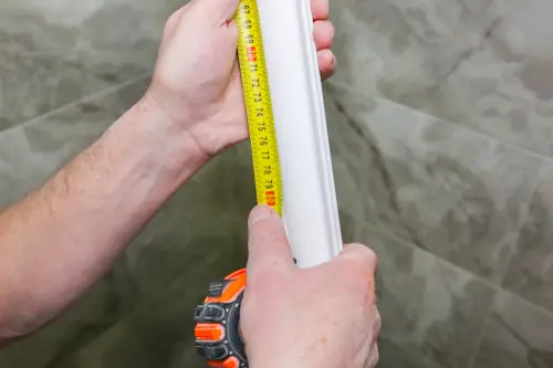Man measuring crown molding