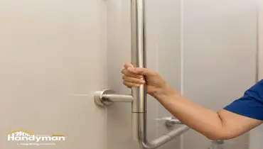 Mr. Handyman inspecting and securing handrails and grab bars in South Montgomery County MD fitness facility