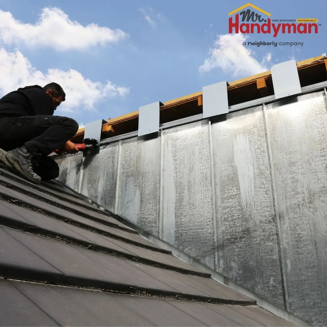 Mr. Handyman technician inspecting commercial building exterior caulking and facade conditions in Plano, Texas.
