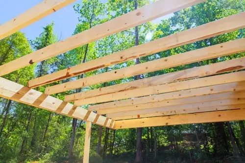 support beams in place for building a roof over a deck.
