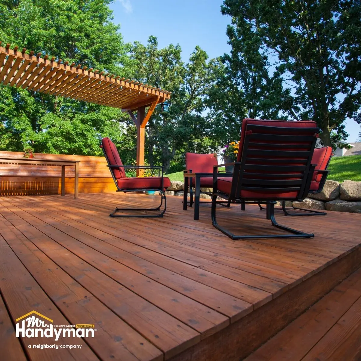 Mr. Handyman technician building outdoor deck and pergola at Montgomery County MD home in spring