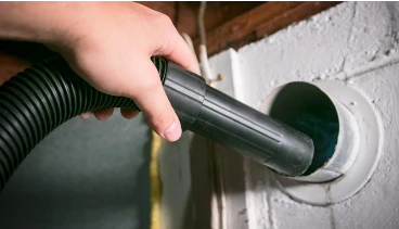 Undergoing dryer vent cleaning service for residential home in Wichita KS