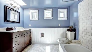 Blue bathroom with white tile-work Blue bathroom with white tile-work