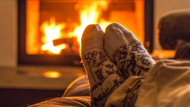 Cozy socks by a warm fireplace during winter in Northern Montgomery County.