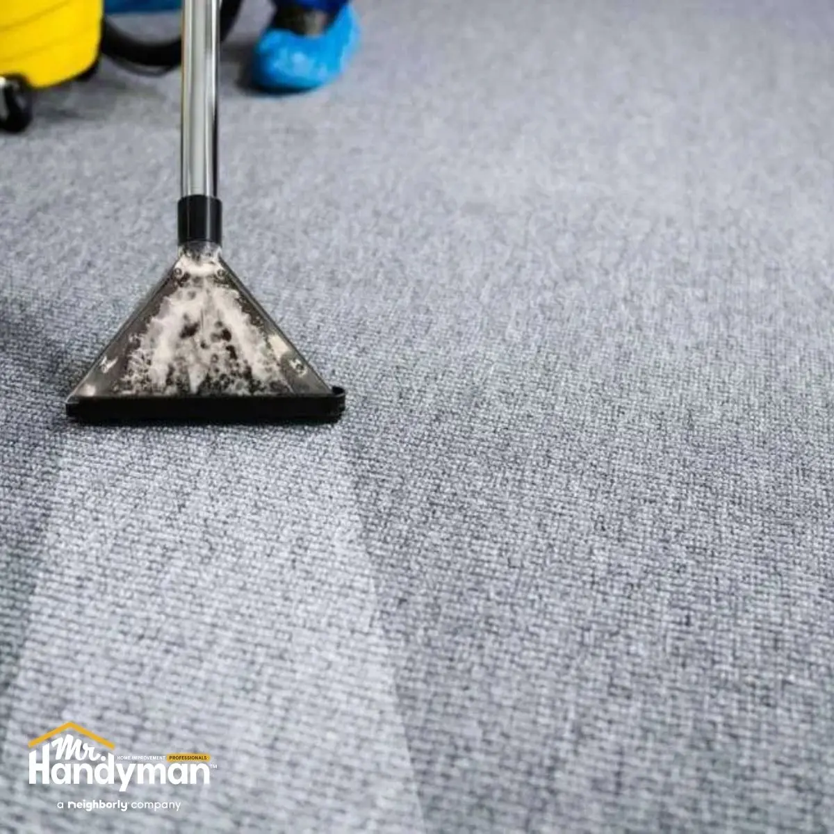 handyman repairing damaged rubber gym flooring in Nashville TN fitness center