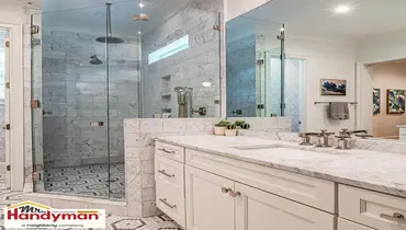 Handyman installing a walk-in shower tile surround during a bathroom remodel in Murfreesboro Tennessee