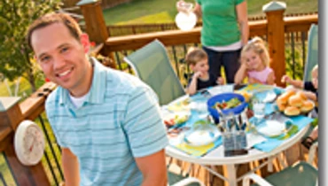 Family enjoying time on the deck after repairs are complete.