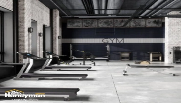 handyman inspecting gym doors and locks in Charleston SC.