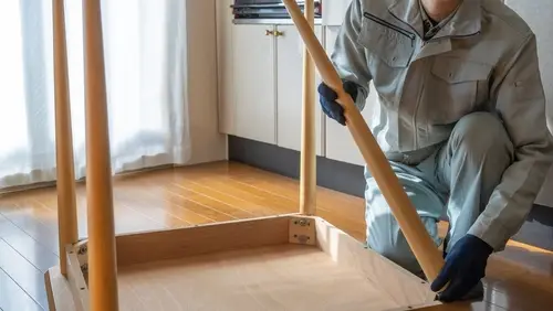 Handyman professional providing home assembly services with the right tools