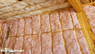 Home insulation winter preparation by handyman.