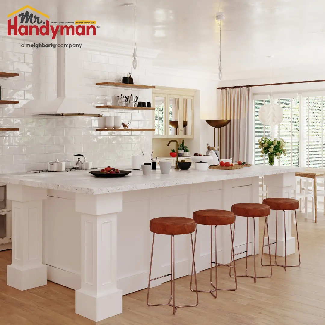 Mr. Handyman technician installing coordinated cabinet hardware and caulking trim joints in a Rockwall, Texas home remodel