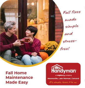 Man and woman sitting outside in front of glass doors.