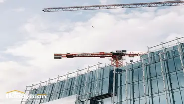 Mr. Handyman technician repairing a commercial building exterior in Murfreesboro before busy season.