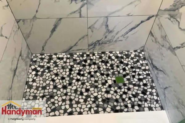 Mr. Handyman professional installing shower tiles in Northern St Joseph