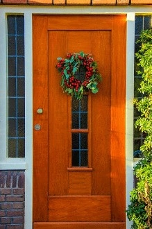 orange wood door with wreath orange wood door with wreath