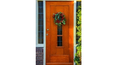 Red front door with wreath.